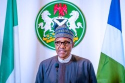 Nigerian President Muhammadu Buhari addresses the nation on the coronavirus disease (COVID-19), in Abuja, March 29, 2020. (Nigeria Presidency/Handout)