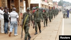 FILE - Congolese soldiers patrol to prevent civilians from protesting against the government's failure to stop the killings and inter-ethnic tensions in the town of Butembo, North Kivu province in the Democratic Republic of Congo, Aug. 25, 2016. 