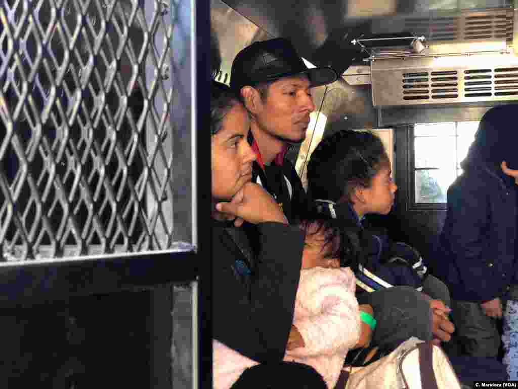 A group of Guatemalan migrants, including five families, waits inside a U.S. Customs and Border Patrol truck after being processed at the crossing at El Paso, Texas, April 9, 2019. They said they walked from Ciudad Juarez, Mexico, and turned themselves in to