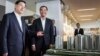Zhang Dejiang (l) chairman of China's National People's Congress, and Hong Kong Chief Executive Leung Chun-ying (r) look at a model of newly built public housing blocks due to open later this year in Hong Kong on May 19, 2016. 