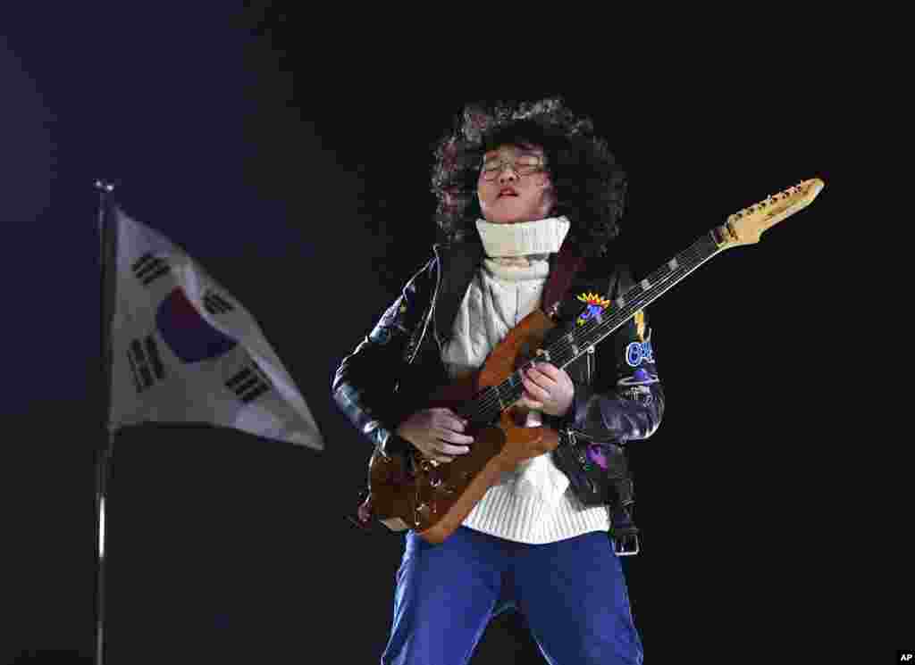 Thirteen-year-old guitarist Yang Tae-hwan plays a variation on 'Winter' from Vivaldi's The Four Seasons, during the closing ceremony of the 2018 Winter Olympics in Pyeongchang, South Korea, Feb. 25, 2018.