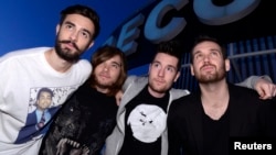 (From L to R) Members of the British electro-pop band Bastille, Kyle Simmons, Chris 'Woody' Wood, Dan Smith and Will Farquarson, pose for pictures at Capitol Studios in Los Angeles, December 5, 2013.