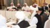 FILE - U.S., Taliban and Qatar officials during a meeting for peace talks in Doha, Qatar.
