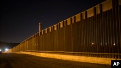 A portion of the new steel border fence stretches along the US-Mexico border in Sunland Park, New Mexico, March 30, 2017. This fencing just west of the New Mexico state line was planned and started before President Donald Trump's election.