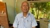 រូបឯកសារ៖ លោក​ មាស មុត​ អតីត​មេបញ្ជាការ​កងទ័ព​ជើង​ទឹក​របស់​របប​ខ្មែរក្រហម​ ដែល​រឿងក្តី​របស់​លោកកំពុង​បន្តទៅមុខ​ទាំង​ភាព​មិន​ច្បាស់​លាស់​​នៅសាលាក្តី​ខ្មែរក្រហម​ អង្គុយនៅក្នុង​​​គេហដ្ឋាន​របស់​​លោក​នៅស្រុក​សំឡូត ខេត្តបាត់​ដំបង ថ្ងៃ​ទី​១៦ ខែ​ធ្នូ​ ឆ្នាំ​២០១៩​។ (សុខ ខេមរា/វីអូអេ)
