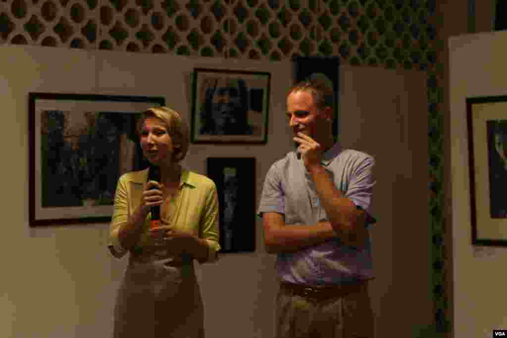 Annick Schubert, field project manager, (left) and Cédric Delannoy, right, photographer speaking at the exhibition.