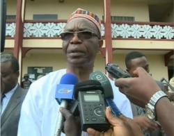 FILE - Governor Deben Tchoffo visited the Presbyterian school where 80 students and their principal were kidnapped in Bafut, near Bamenda, Nov. 5, 2018.