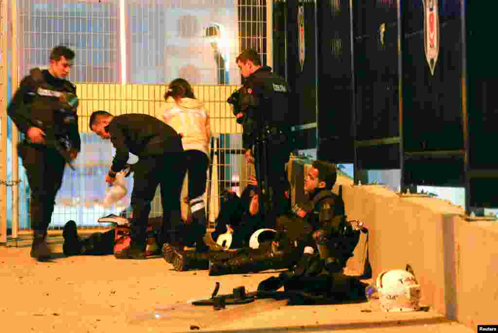 Turkish policemen are at the site of an explosion in central Istanbul, Dec. 10, 2016.