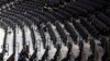 Workers clean the Wells Fargo Center after an NBA basketball game between the Philadelphia 76ers and the Detroit Pistons, Wednesday, March 11, 2020, in Philadelphia.