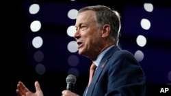 FILE - Former Colorado Gov. John Hickenlooper speaks at the Presidential Gun Sense Forum, Aug. 10, 2019, in Des Moines, Iowa.