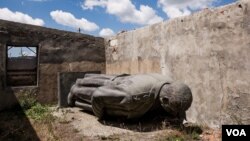 FILE - This 6-meter-high bronze statue of Josef Stalin, the Soviet dictator, was removed from the central square of Gori, Georgia, his birthplace. This week, a bust of Stalin was removed for violating a ban on "public display of symbols of totalitarianism." 
