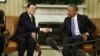 President Barack Obama shakes hands with Vietnam's President Truong Tan Sang during their meeting in the Oval Office at the White House in Washington, July 25, 2013.