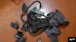 FILE - A photo taken on Sept. 18, 2024, in Beirut's southern suburbs shows the remains of exploded pagers on display at an undisclosed location.