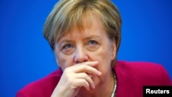 German Chancellor Angela Merkel attends a board meeting following the Hesse state election in Berlin, Germany, Oct. 29, 2018.
