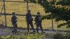 FILE - South Korean army soldiers patrol the wire fences near the demilitarized zone between the two Koreas in Paju, South Korea, Oct. 7, 2014.