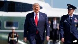 President Donald Trump boards Air Force One for a trip to Minnesota and Wisconsin, Aug. 17, 2020, in Andrews Air Force Base, Md.
