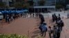 Hong Kong Leader Says City ‘Overwhelmed’ by Omicron Wave 