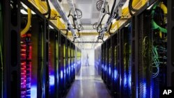 An undated file photo made available by Google shows the campus-network room at a data center in Council Bluffs, Iowa. 