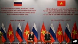 Ruski predsjednik Vladimir Putin, lijevo, i vijetnamski predsjednik To Lam prisustvuju događaju Vijetnamskog udruženja prijateljstva u Hanoju, četvrtak, 20. juna 2024. (Manan Vatsyayana, Pool Photo via AP)