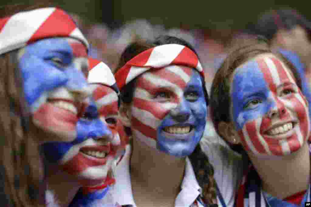 Fans of the United States with painted faces smile in the stands before the FIFA Women's World Cup soccer championship between the U.S. and Japan in Vancouver, British Columbia, July 5, 2015.