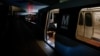 FILE - A lone Metro rider sits on a train in Washington's L'Enfant Plaza Station in this March 2015 photo. 