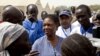 United Nations Under-Secretary-General for Humanitarian Affairs and Emergency Relief Coordinator for South Sudan, Valerie Amos, engages with local government officials and humanitarian aid workers in the village of Walgak, South Sudan on Thursday, Feb. 2,
