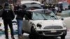Police work at a car which drove into a crowd in Munich, Germany, Feb.13, 2025, injuring several people. 