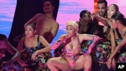 FILE - Nicki Minaj performs during the MTV EMA's 2018 at Bilbao Exhibition Centre, Nov. 4, 2018, in Bilbao, Spain. 