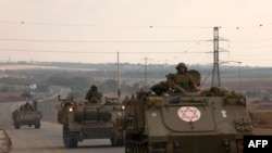 Wanajeshi wa Israeli wakiyasogeza magari ya kivita na kukusanyika katika mpaka wa Ukanda wa Gaza October 16, 2023, huku mapigano yakiendelea kati ya Israel na kikundi cha Palestina cha Hamas.