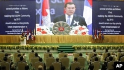 Cambodia's Prime Minister Hun Sen delivers his opening speaks for the 21st Association of Southeast Asian Nations or ASEAN Summit in Phnom Penh, Cambodia, Sunday, Nov. 18, 2012. 