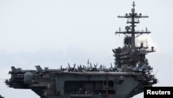 FILE - The USS Theodore Roosevelt is seen while entering the port at Da Nang, Vietnam, March 5, 2020.