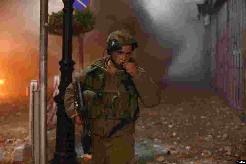 An Israeli soldier is seen during clashes with Palestinian stone throwers in the West Bank city of Ramallah.