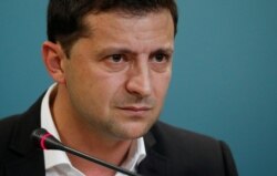 Ukrainian President Volodymyr Zelenskiy reacts during a news conference in Kyiv, Ukraine, Oct. 1, 2019.