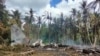Les restes d'un avion C-130 de l'armée philippine qui s'est écrasé dans la ville de Patikul, dans la province de Sulu, dans le sud des Philippines, le dimanche 4 juillet 2021.