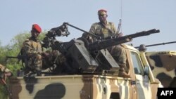FILE - A convoy of Cameroon's army soldiers as part of a reinforcement of its military forces against Nigerian Islamist group Boko Haram.
