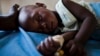 A young girl with malaria rests at a health clinic in the South Sudanese state of Northern Bahr el Ghazal, June 1, 2012.