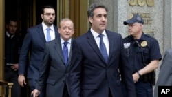 President Donald Trump's personal attorney Michael Cohen (R) and his attorney Stephen Ryan (2nd-L) leave Federal Court, in New York, May 30, 2018. 