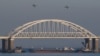 FILE - Russian jet fighters fly over a bridge connecting the Russian mainland with the Crimean Peninsula after three Ukrainian navy vessels were stopped by Russia from entering the Sea of Azov via the Kerch Strait in the Black Sea, Crimea, Nov. 25, 2018.