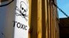 FILE - A sticker reading Toxic on containers carrying Syria's dangerous chemical weapons, on the Danish cargo ship, Ark Futura, transporting the chemical weapons out of the strife-torn country, in Cyprus coastal waters.