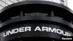 FILE - An Under Armour sign is seen outside a store in Chicago, Oct. 25, 2016. Under Armour said March 29, 2018, that it was working with data security firms and law enforcement in the wake of a data breach affecting 150 million MyFitnessPal diet an