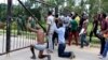University of Zambia students "surrender" to police in Lusaka after the Zambian government announced the university's closure, Feb. 3, 2016.