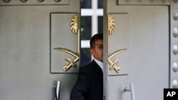 FILE - A security guard walks in the Saudi Arabia consulate in Istanbul, Oct. 9, 2018. 