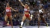 United States' Allyson Felix crosses the finish line to win the women's 200-meters final ahead of compatriot Carmelita Jeter, left, and Ivory Coast's Murielle Ahoure during the athletics in the Olympic Stadium at the 2012 Summer Olympics, London, Wednesd