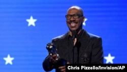FILE - Eddie Murphy accepts a lifetime achievement award at the 25th annual Critics' Choice Awards in Santa Monica, Calif., Jan. 12, 2020. He'll receive the Cecil B. DeMille Award at the 80th Golden Globes, to be telecast Jan.. 10, 2023. 