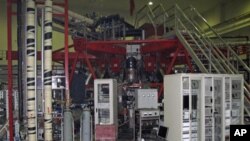FILE - An experimental nuclear fusion reactor at a laboratory in the Southwest Institute of Physics in Chengdu, Sichuan Province. 