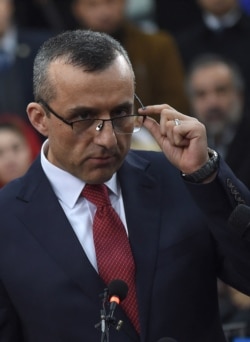 First vice-presidential candidate Amrullah Saleh looks on as he speaks to the media after arriving at the Independent Electoral Commission office in Kabul on Jan. 20, 2019.