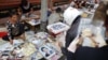 Vendors sell pictures of the royal family, as the country prepares for the funeral of Cambodia's late King Norodom Sihanouk, near the Royal Palace in Phnom Penh, January 31, 2013. 