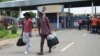 FILE - Students leave the campus at the North-West University in Mahikeng, South Africa, (also known as Mafikeng) Feb. 25, 2016. 