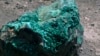A piece of malachite, a copper ore, is seen at the bottom of Congolese state mining company Gecamines' Kamfundwa open pit copper mine, Jan. 31, 2013. 