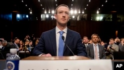 Facebook CEO Mark Zuckerberg arrives to testify before a joint hearing of the Commerce and Judiciary Committees on Capitol Hill in Washington, April 10, 2018.